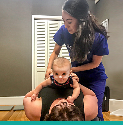 Dr. Morrison performing adjustment on child